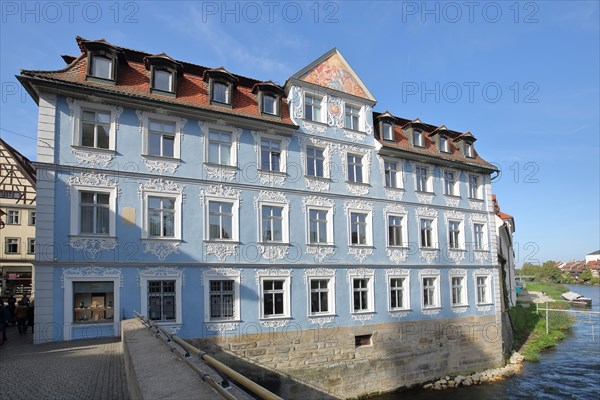 Blue Heller House with ornamentation and stucco on the Regnitz River