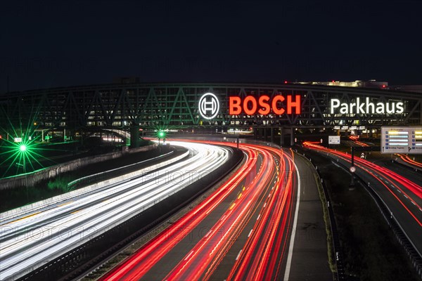 A8 motorway at Stuttgart Airport with Bosch multi-storey car park. The 440-metre-long structure provides space for 4200 vehicles. Bosch has the naming rights