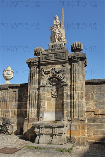 Green Dog Fountain built in 1777 with sculptures and pilasters