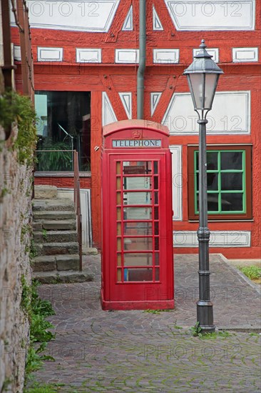 Old red telephone box and street lamp