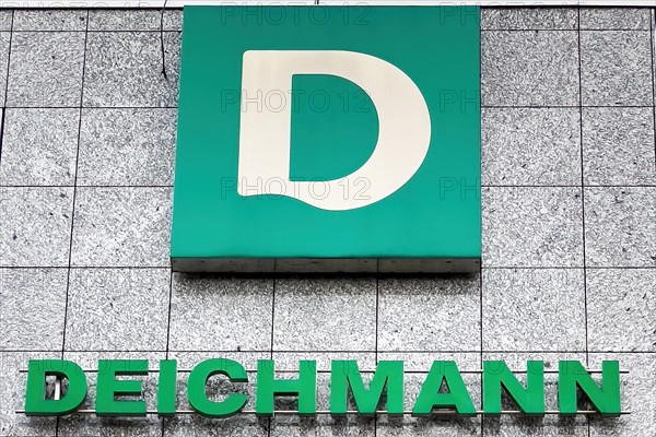 Logo of family business shoe manufacturer retail for shoes Deichmann below lettering on building with headquarters in Essen