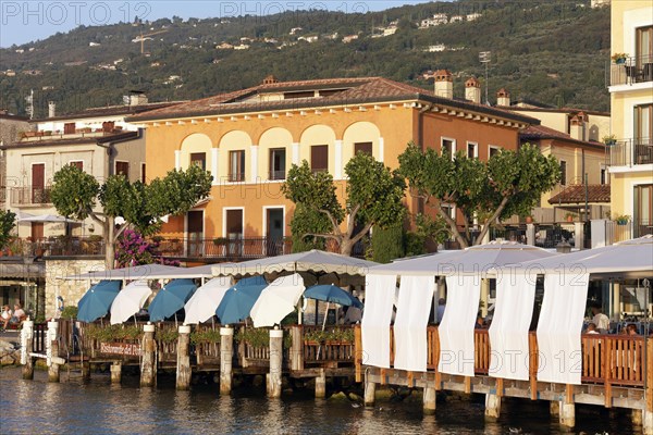 Restaurant terraces with sunshades on the lakeshore