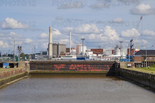 Sea lock in front of industrial harbour