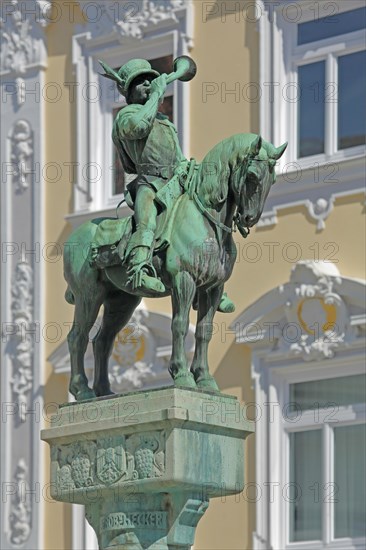 Equestrian figure with post horn in uniform