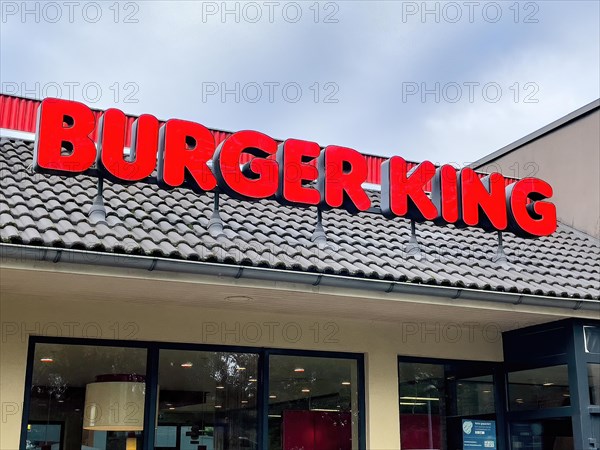 Red lettering Burger King in red over restaurant Schnellrestaurant fuer Fastfood by Fastfoodkette