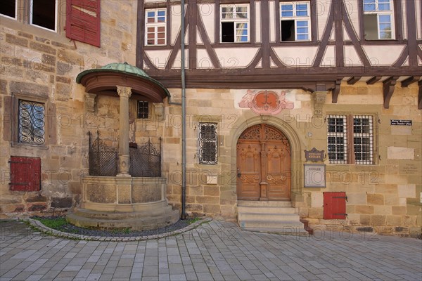 House facade with historic draw well