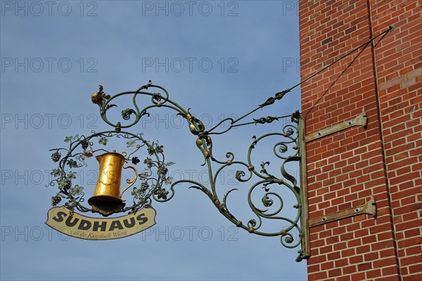 Red brewhouse with chimney and nose shield