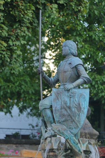 Sculpture Saint George with shield and city coat of arms