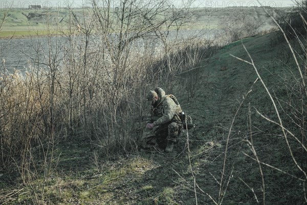 Ukrainian soldiers during a patrol along the Ingulez River. In the small town of Snihurivka