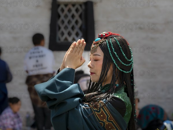 Tibetan young woman with festival clothes