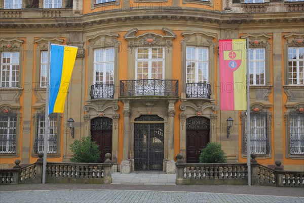Baroque town hall built 1735 with Ukrainian national flag and town flag