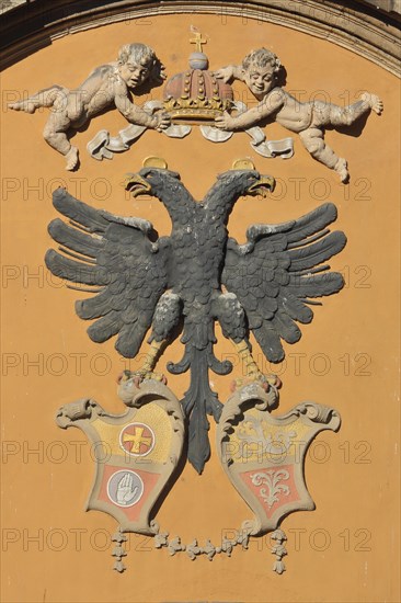 City coat of arms with double eagle angel and two crowns at the town hall