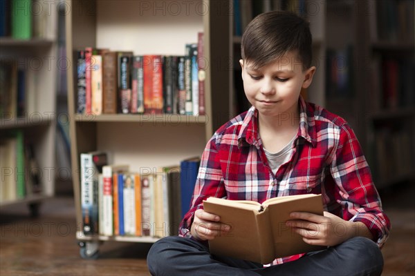 High angle little boy reading