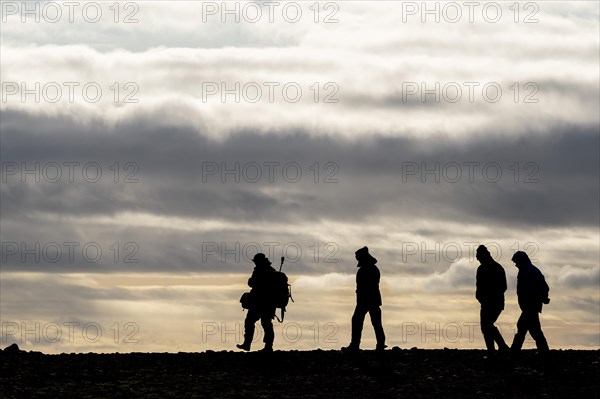 Silhouette Tourist Guide and Tourists