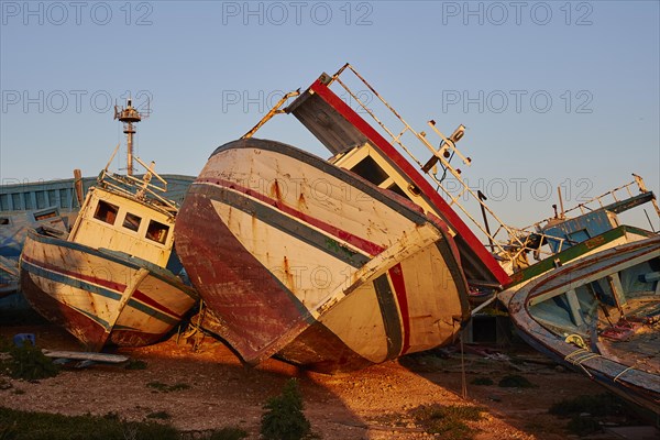 Larger cabin boat lying on its side