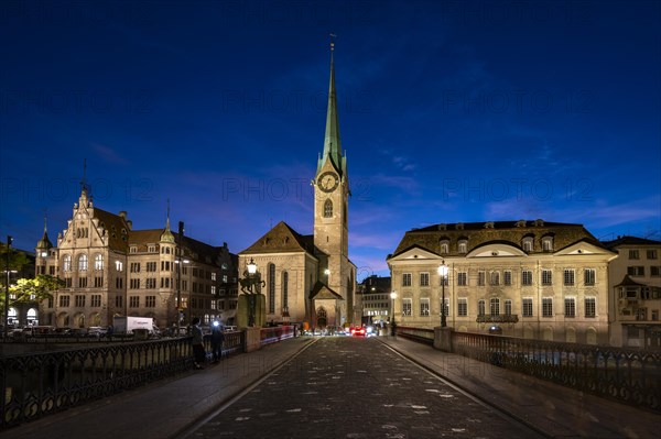 Fraumünster with Stadthaus and Münsterhof from Münsterbrücke at dusk