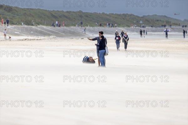 Sand kicked up during storm on the North Sea coast in De Panne