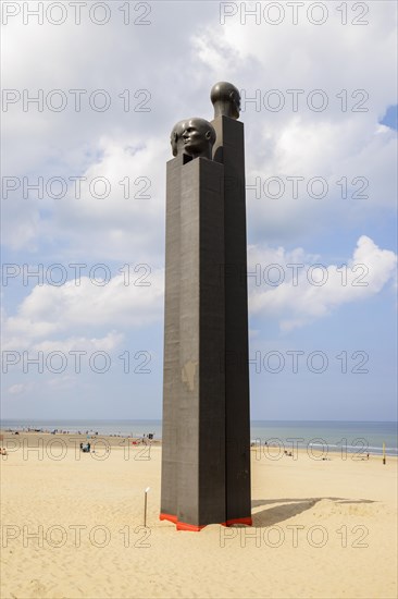 The sculpture The Three White Noses on the beach of De Panne