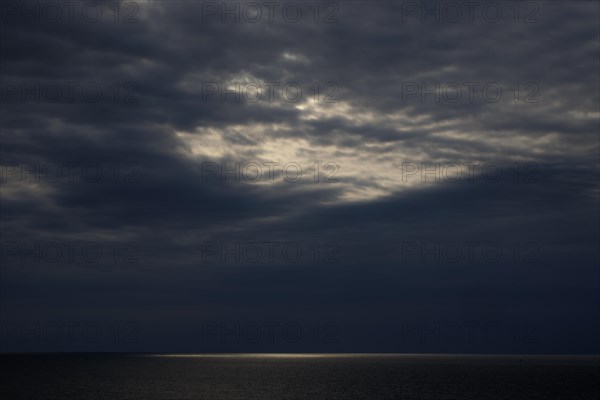 Dark clouds and sunlight over the North Sea