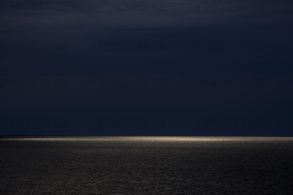 Dark clouds and sunlight over the North Sea