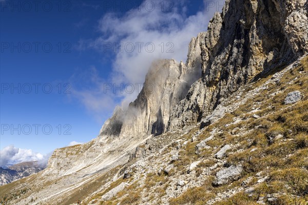 Wisps of clouds drift over the peaks