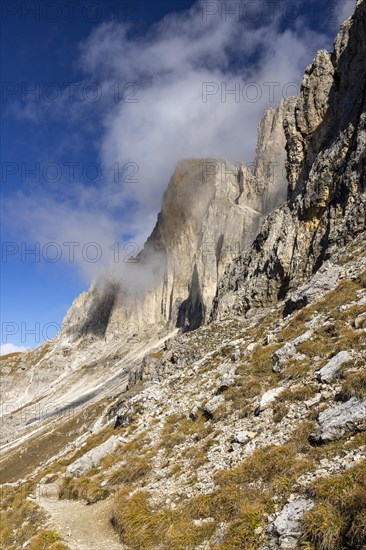 Wisps of clouds drift over the peaks