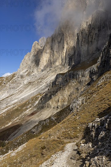 Wisps of clouds drift over the peaks