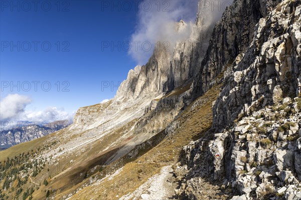 Wisps of clouds drift over the peaks