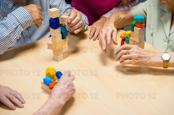 Top view of a table of a nursing home with people playing with skill games