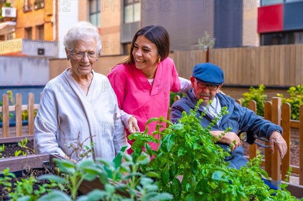 Nurse and elder people in an urban garden in a geriatric