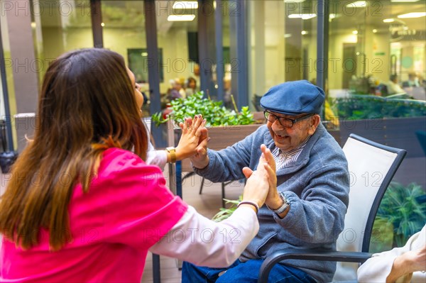 Nurse playing with seniors to develop psychomotor skills in a geriatric