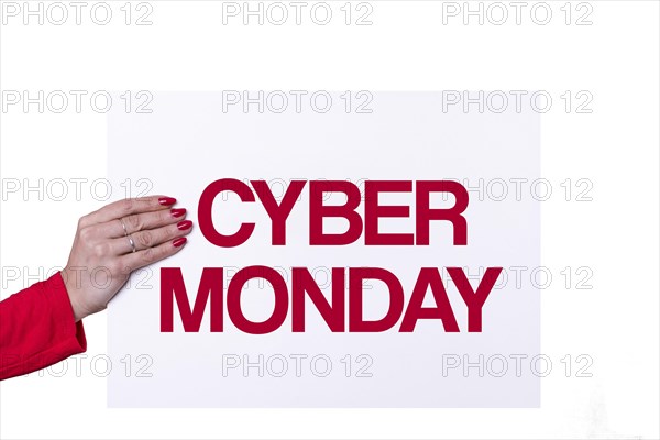 Woman hand holding a CYBER MONDAY white poster on transparent background. Studio shot. Commercial concept
