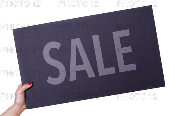 Woman hand holding a SALE black poster on transparent background. Studio shot. Commercial concept