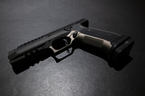 Modern Elegant Handgun on Grey Background in Switzerland