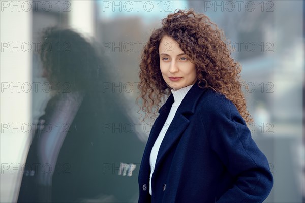 Urban portrait of ambitious young woman