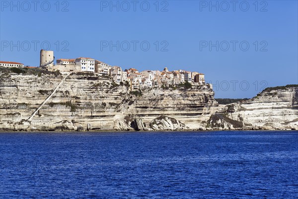 Upper town with the staircase of the King of Aragon on white chalk cliffs