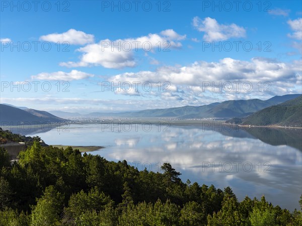 Lashihai Lake surrounded by mountains and forests