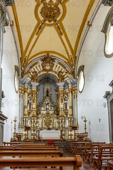 Interior and altar of a historic baroque style church in the city of Mariana in Minas Gerais