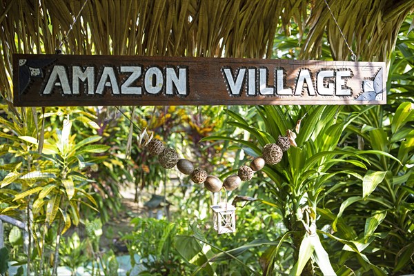 Amazon Village sign in the Amazon rainforest