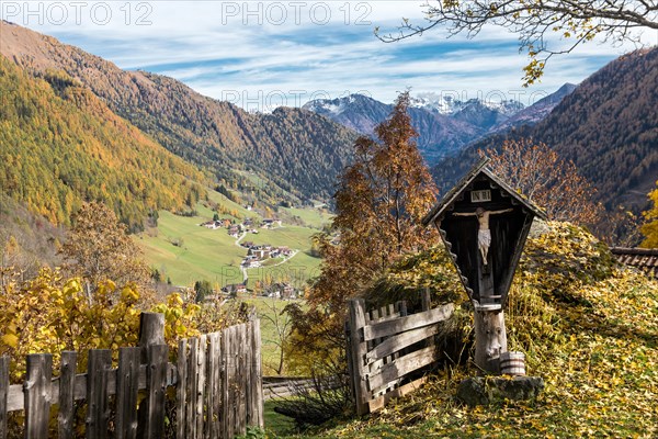 Cross in front of hut fence