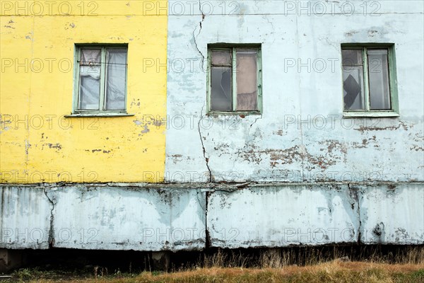 Damage caused by thawing permafrost in a housing estate