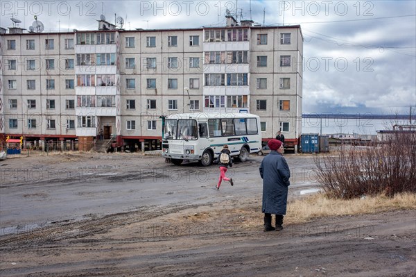 School bus stops in a housing estate