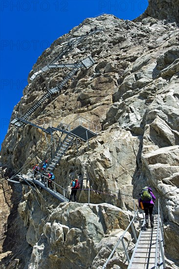 Metal stairs on a rock face as a train access to the Konkordiahütte mountain hut