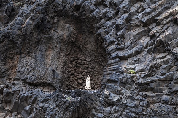 Madonna figure in volcanic rock