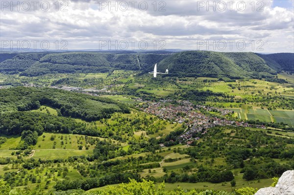 Glider flying over Unterlenningen in the Swabian Alb