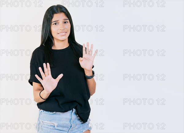 Displeased teenage girl rejecting with palms hands isolated. Disgusted young girl with rejection gesture. He frowns in disgust