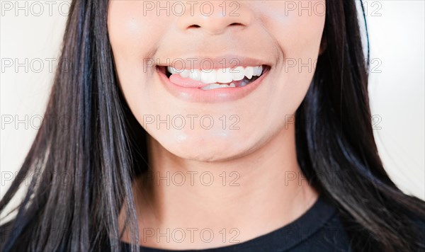 Close up of sexy girl biting tongue. Girl mouth biting her tongue isolated