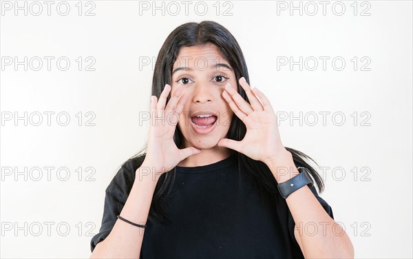 Young girl announcing something to the camera. Young woman screaming and announcing at the camera