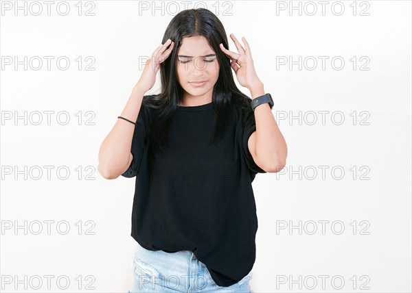 Tired and worried girl holding his forehead. Worried people isolated. Tired latin girl holding his head