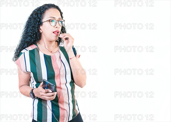Young afro woman calling on the phone with earphones isolated